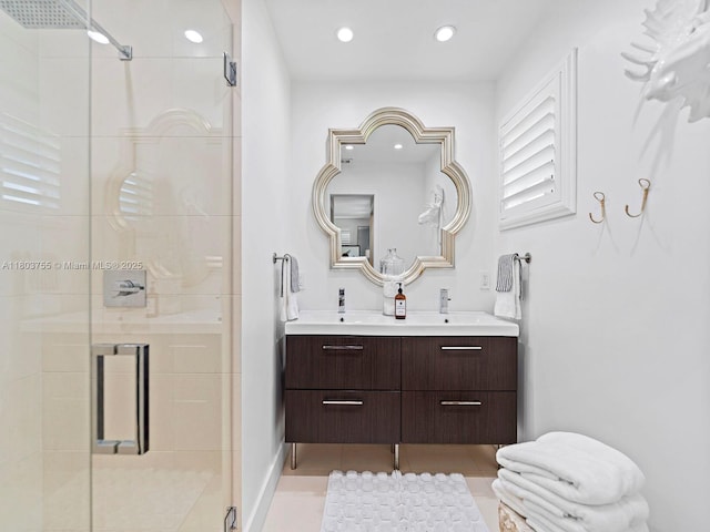 7945 SW 98th Ter, Miami, FL 33156 - bathroom featuring a shower stall, double vanity, tile patterned flooring, and recessed lighting