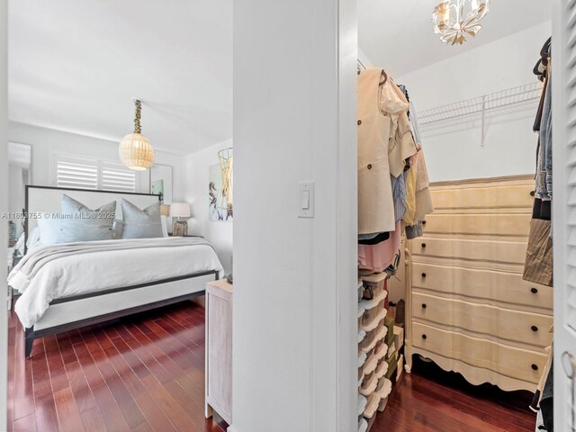 7945 SW 98th Ter, Miami, FL 33156 - bedroom featuring hardwood / wood-style floors and a chandelier