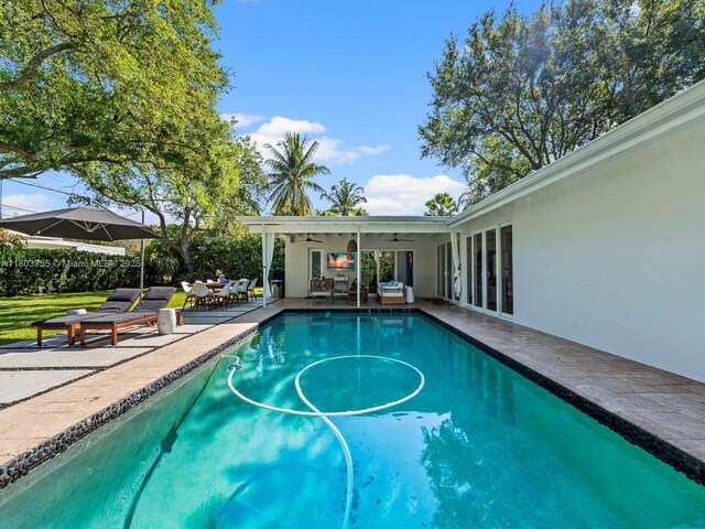 7945 SW 98th Ter, Miami, FL 33156 - view of swimming pool with a patio area and ceiling fan