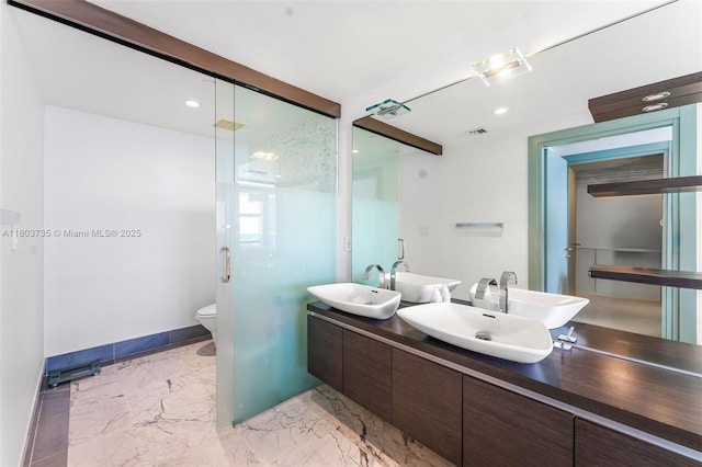 200 Biscayne Boulevard Way Unit 4005, Miami, FL 33131 - full bathroom with marble finish floors, baseboards, double vanity, recessed lighting, and toilet