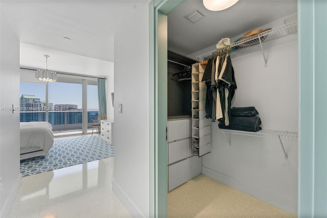200 Biscayne Boulevard Way Unit 4005, Miami, FL 33131 - walk in closet featuring a chandelier