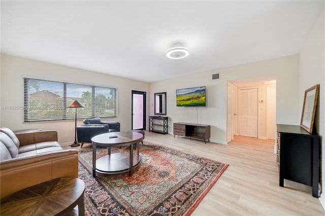 2 NW 47th St, Miami, FL 33127 - living room featuring light wood-style flooring and baseboards