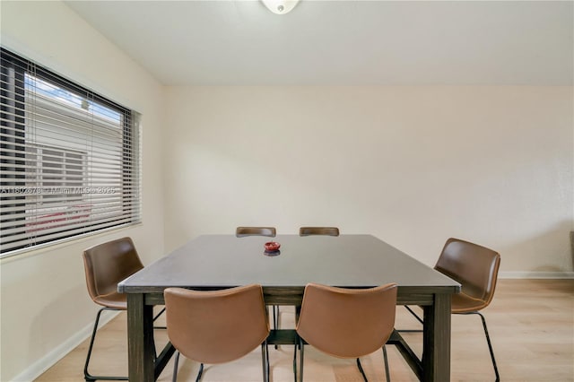 2 NW 47th St, Miami, FL 33127 - dining space featuring baseboards and light wood-type flooring