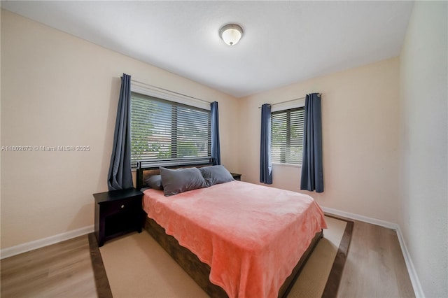 2 NW 47th St, Miami, FL 33127 - bedroom featuring light wood-style flooring and baseboards