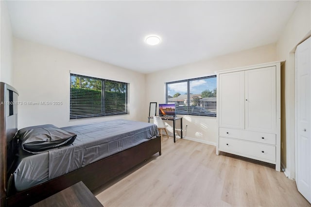 2 NW 47th St, Miami, FL 33127 - bedroom featuring light wood-style flooring and baseboards