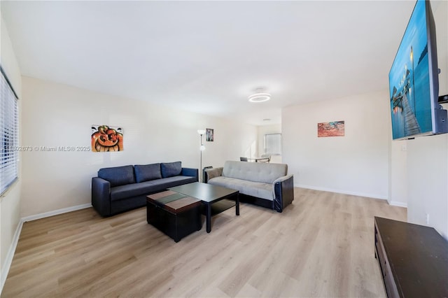 2 NW 47th St, Miami, FL 33127 - living area with light wood finished floors and healthy amount of natural light