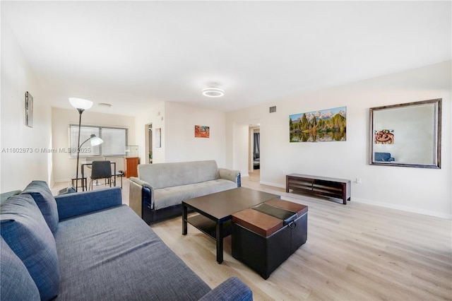 2 NW 47th St, Miami, FL 33127 - living room with light wood finished floors and baseboards