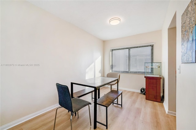 2 NW 47th St, Miami, FL 33127 - dining area with light wood-type flooring and baseboards