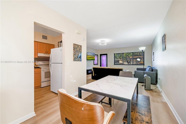 2 NW 47th St, Miami, FL 33127 - dining room featuring light wood finished floors
