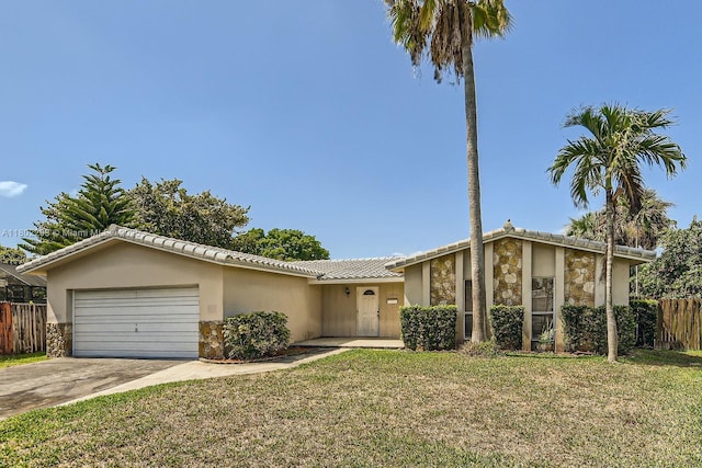 10950 NW 38th Ct, Coral Springs, FL 33065 - view of front of house featuring stone siding, a garage, driveway, and stucco siding