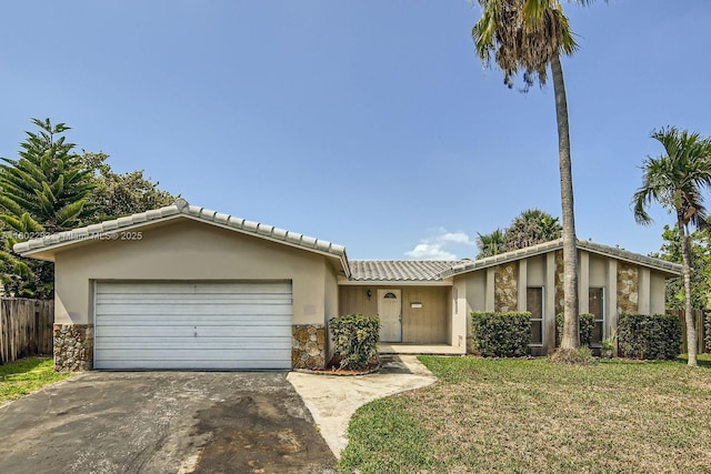 10950 NW 38th Ct, Coral Springs, FL 33065 - view of front of property with stone siding, concrete driveway, stucco siding, and an attached garage
