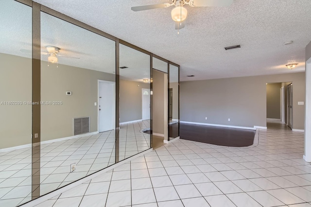 10950 NW 38th Ct, Coral Springs, FL 33065 - kitchen featuring stainless steel microwave, wall chimney exhaust hood, backsplash, a kitchen island, and dark cabinets