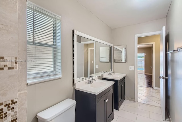 10950 NW 38th Ct, Coral Springs, FL 33065 - full bath featuring tile patterned flooring, two vanities, and toilet