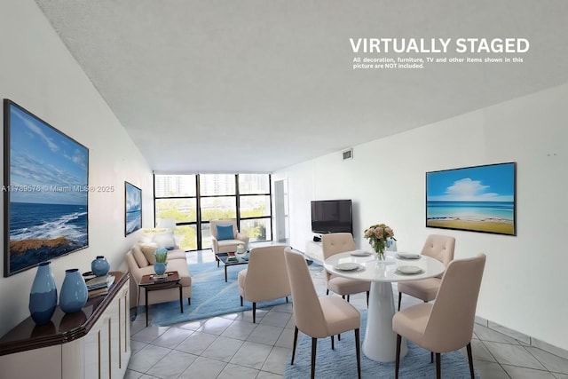 1000 Parkview Dr Unit 424, Hallandale Beach, FL 33009 - dining space with a wall of windows and light tile patterned flooring
