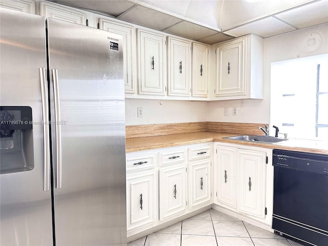 1000 Parkview Dr Unit 424, Hallandale Beach, FL 33009 - kitchen featuring stainless steel fridge, dishwasher, light countertops, white cabinets, and a paneled ceiling