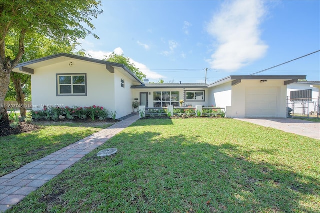 9450 Martinique Dr, Cutler Bay, FL 33189 - view of front of home featuring a garage, stucco siding, and concrete driveway