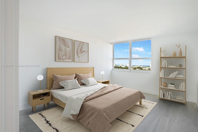 650 W Ave Unit 1404, Miami Beach, FL 33139 - bedroom featuring baseboards and wood finished floors