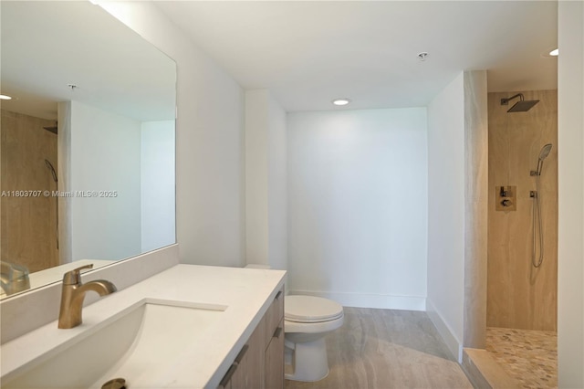 650 W Ave Unit 1404, Miami Beach, FL 33139 - bathroom featuring vanity, walk in shower, toilet, recessed lighting, and baseboards