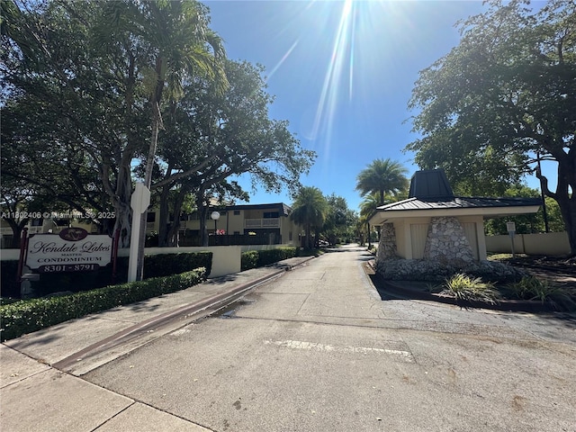 8443 SW 137th Ave Unit 8443, Miami, FL 33183 - view of concrete road featuring traffic signs