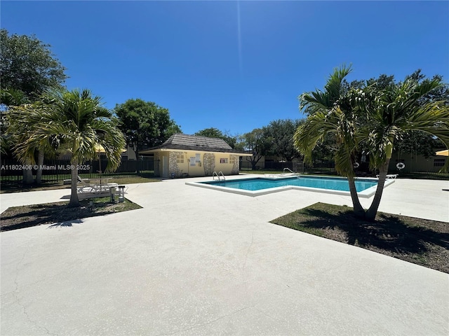 8443 SW 137th Ave Unit 8443, Miami, FL 33183 - community pool with a patio and an outbuilding
