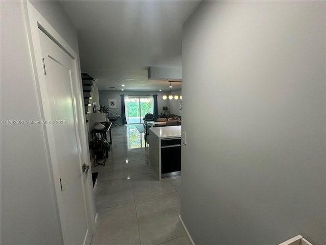 8443 SW 137th Ave Unit 8443, Miami, FL 33183 - hallway featuring light tile patterned floors and baseboards