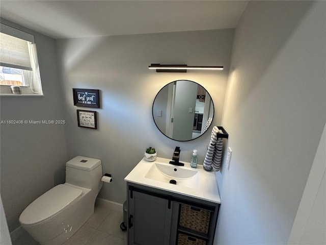 8443 SW 137th Ave Unit 8443, Miami, FL 33183 - bathroom featuring toilet, vanity, tile patterned floors, and baseboards