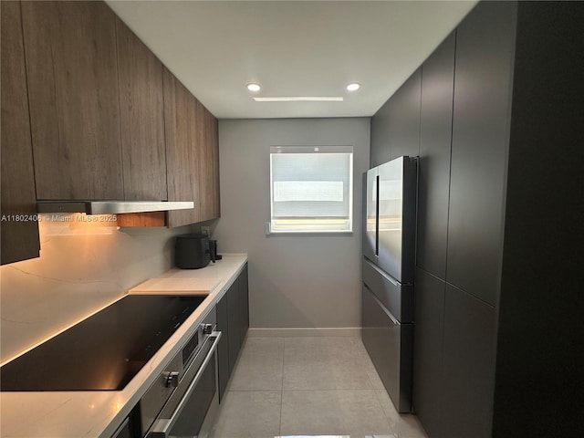 8443 SW 137th Ave Unit 8443, Miami, FL 33183 - kitchen with modern cabinets, stainless steel appliances, baseboards, recessed lighting, and light tile patterned flooring
