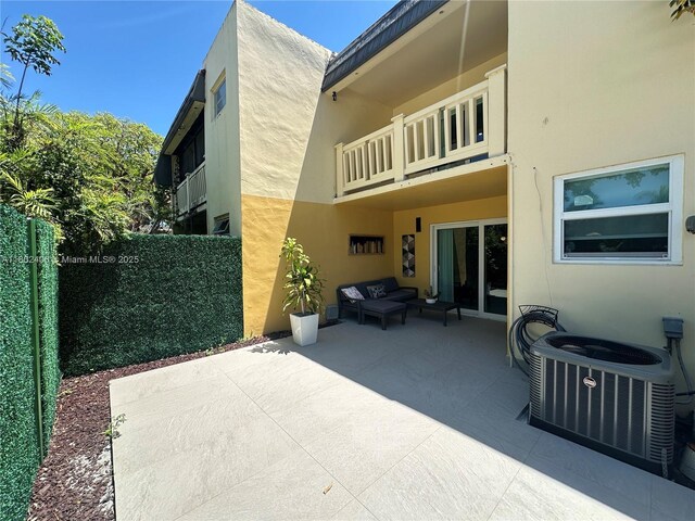 8443 SW 137th Ave Unit 8443, Miami, FL 33183 - rear view of property with stucco siding, a patio area, a balcony, and outdoor lounge area