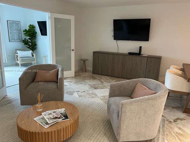 2301 Collins Ave Unit 731, Miami Beach, FL 33139 - living area featuring baseboards and light marble finish flooring