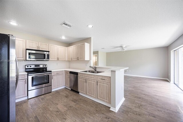16421 SW 103rd Ter, Miami, FL 33196 - kitchen with appliances with stainless steel finishes, baseboards, light countertops, recessed lighting, and dark wood-type flooring
