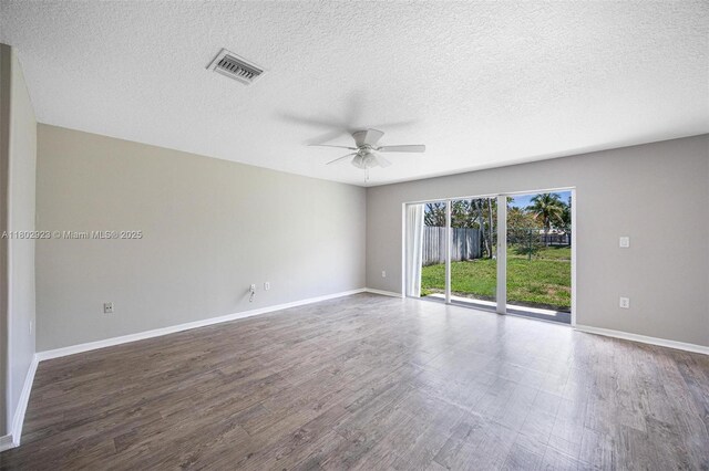 16421 SW 103rd Ter, Miami, FL 33196 - spare room with a ceiling fan, wood finished floors, a textured ceiling, and baseboards