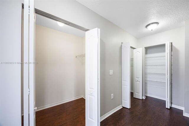 16421 SW 103rd Ter, Miami, FL 33196 - unfurnished bedroom featuring a textured ceiling, wood finished floors, and baseboards