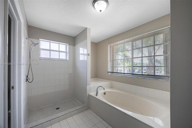 16421 SW 103rd Ter, Miami, FL 33196 - full bath featuring tile patterned flooring, a bath, tiled shower, and a textured ceiling