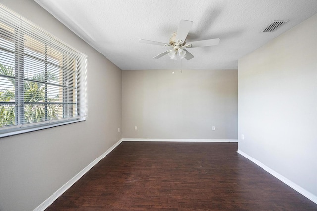 16421 SW 103rd Ter, Miami, FL 33196 - spare room featuring wood finished floors, a ceiling fan, baseboards, and a textured ceiling