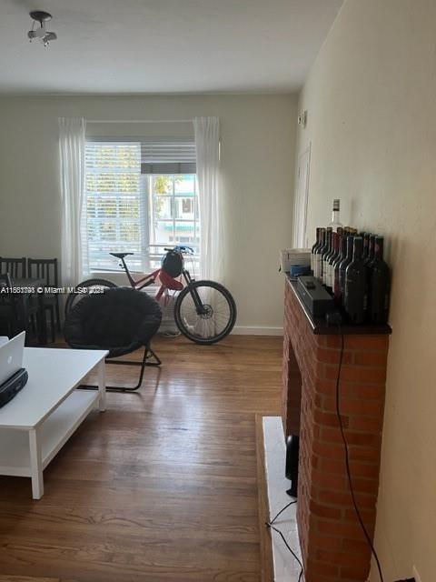 741 15th St Unit 8, Miami Beach, FL 33139 - living room with wood finished floors and baseboards