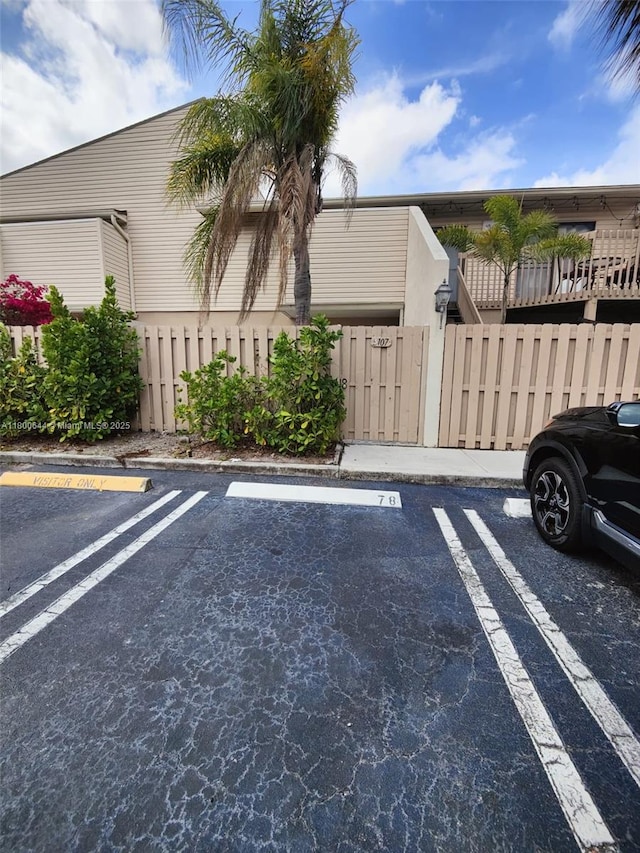 616 Executive Center Dr Unit 107, West Palm Beach, FL 33401 - uncovered parking lot with a gate