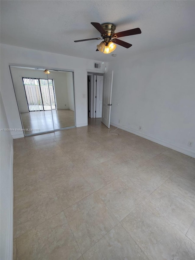 616 Executive Center Dr Unit 107, West Palm Beach, FL 33401 - unfurnished room with ceiling fan and baseboards