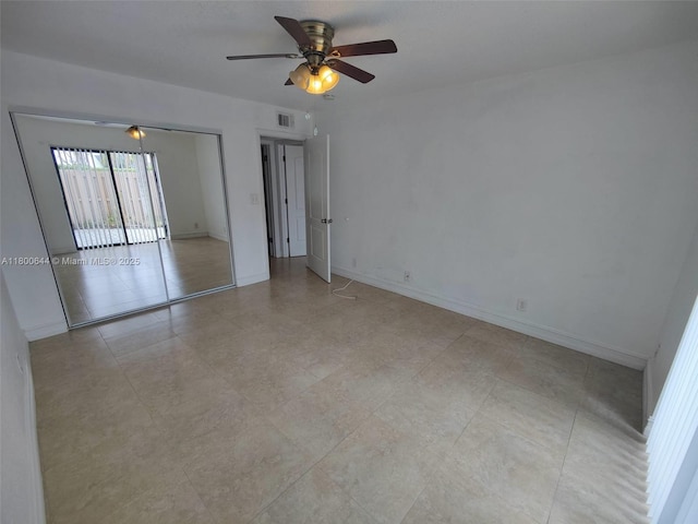 616 Executive Center Dr Unit 107, West Palm Beach, FL 33401 - unfurnished room featuring a ceiling fan and baseboards