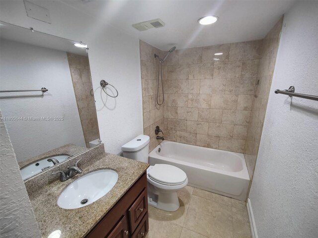 616 Executive Center Dr Unit 107, West Palm Beach, FL 33401 - bathroom featuring vanity,  shower combination, toilet, tile patterned flooring, and a textured wall