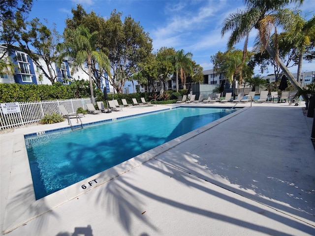 616 Executive Center Dr Unit 107, West Palm Beach, FL 33401 - community pool featuring a patio area and a residential view