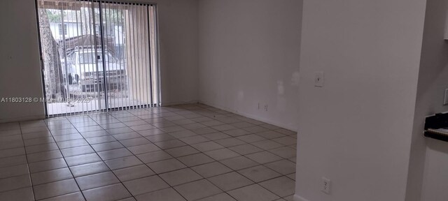 4009 N University Dr Unit 112, Sunrise, FL 33351 - unfurnished room featuring light tile patterned floors and baseboards