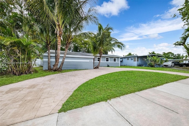 19735 NE 12th Ave, Miami, FL 33179 - ranch-style house featuring a front yard and concrete driveway