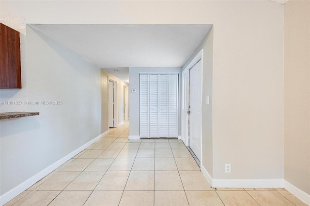 19735 NE 12th Ave, Miami, FL 33179 - hall featuring light tile patterned floors and baseboards