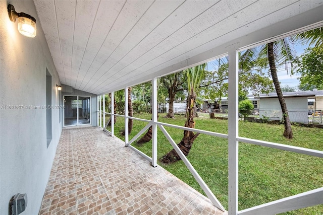 19735 NE 12th Ave, Miami, FL 33179 - unfurnished sunroom with lofted ceiling