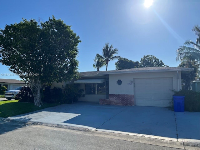 1130 NW 67th Ave, Margate, FL 33063 - single story home with driveway, brick siding, and a garage