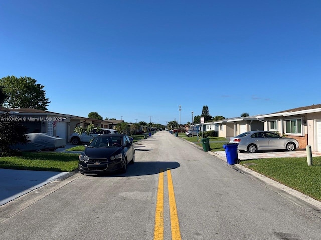 1130 NW 67th Ave, Margate, FL 33063 - view of asphalt street with a residential view and curbs