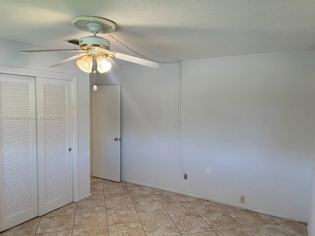 1130 NW 67th Ave, Margate, FL 33063 - unfurnished bedroom featuring a closet, a ceiling fan, a textured ceiling, and light tile patterned flooring