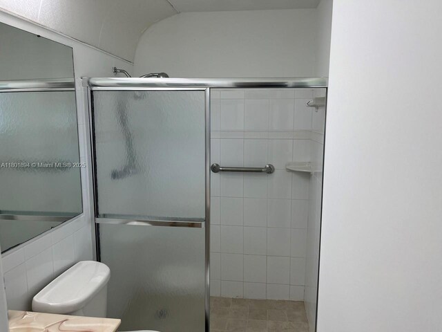 1130 NW 67th Ave, Margate, FL 33063 - full bathroom featuring a shower stall, toilet, and vanity