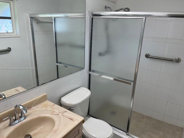 1130 NW 67th Ave, Margate, FL 33063 - full bath with a stall shower, toilet, and vanity