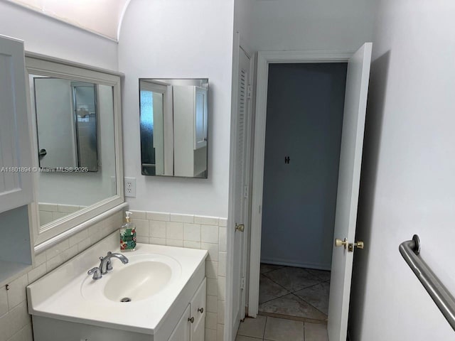 1130 NW 67th Ave, Margate, FL 33063 - bathroom with vanity, tile patterned floors, and tile walls